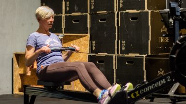 Nk Fitness client with excellent fitness training consistency trains using a concept 2 rowing machine.
