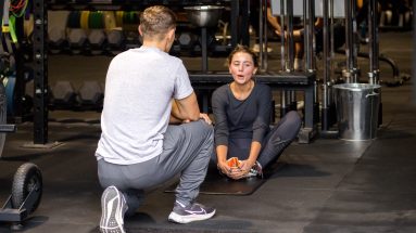 Young female athlete performing sit ups with youth strength and conditioning Ascot NK Fitness